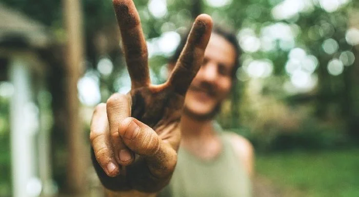 man with peace sign